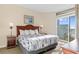 Serene bedroom with a comfortable bed, balcony access, and soft lighting for a restful retreat at 2501 S Ocean Blvd. # 831, Myrtle Beach, SC 29577