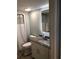 Clean bathroom featuring a granite countertop, white cabinets, and tiled shower at 3000 Ocean Blvd. N # 508, Myrtle Beach, SC 29577