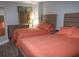 Comfortable bedroom with two beds, a dresser, and a calming color scheme at 3000 Ocean Blvd. N # 508, Myrtle Beach, SC 29577