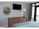 Comfortable bedroom with modern decor, flat screen tv, and access to balcony at 3000 Ocean Blvd. N # 508, Myrtle Beach, SC 29577