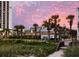 Coastal restaurant exterior with palm trees and beautiful sunset at 3000 Ocean Blvd. N # 508, Myrtle Beach, SC 29577