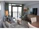 Cozy living room featuring a balcony with ocean views, comfortable seating, and modern decor at 3000 Ocean Blvd. N # 508, Myrtle Beach, SC 29577