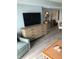 Light and bright living room area featuring modern furniture, a TV, and coastal decor at 3000 Ocean Blvd. N # 508, Myrtle Beach, SC 29577