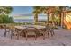 Outdoor patio featuring a modern fire pit surrounded by comfortable seating near beach and palm trees at 3000 Ocean Blvd. N # 508, Myrtle Beach, SC 29577