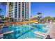 Resort-style pool with waterslide and high-rise tower in background at 3000 Ocean Blvd. N # 508, Myrtle Beach, SC 29577