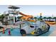 Fun outdoor pool area with a submarine splash pad and water slide for resort guests at 3000 Ocean Blvd. N # 508, Myrtle Beach, SC 29577