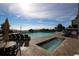 Outdoor pool and hot tub with lounge chairs and seating areas overlooking the ocean at 3000 Ocean Blvd. N # 508, Myrtle Beach, SC 29577