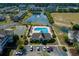 Aerial view of a community pool and lake, offering a serene setting at 334 Kiskadee Loop # 18-L, Conway, SC 29526