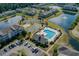 Community aerial view of pool, sports courts, clubhouse, and picturesque lakes at 334 Kiskadee Loop # 18-L, Conway, SC 29526