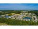 Aerial community view showcasing the lake, pool, and lush green surroundings at 334 Kiskadee Loop # 18-L, Conway, SC 29526