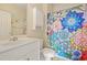 Bathroom featuring a modern vanity, toilet, and a colorful shower curtain at 334 Kiskadee Loop # 18-L, Conway, SC 29526