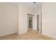 Bedroom showcasing a mirrored closet and doorway to ensuite bathroom at 334 Kiskadee Loop # 18-L, Conway, SC 29526