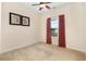 Bedroom featuring window with curtains and ceiling fan with artwork on walls at 334 Kiskadee Loop # 18-L, Conway, SC 29526