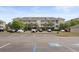 Exterior building view showcasing multiple units, balconies, and convenient parking at 334 Kiskadee Loop # 18-L, Conway, SC 29526