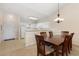 Dining area featuring a wooden table, six chairs, and an adjacent kitchen at 334 Kiskadee Loop # 18-L, Conway, SC 29526