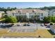 Two-story condo with balconies, palm trees, and a large parking area at 334 Kiskadee Loop # 18-L, Conway, SC 29526