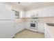 Bright kitchen featuring white appliances, cabinets, and tile flooring at 334 Kiskadee Loop # 18-L, Conway, SC 29526