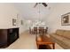 Living and dining area with fireplace, furniture, neutral walls and adjacent kitchen at 334 Kiskadee Loop # 18-L, Conway, SC 29526