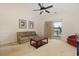 Living room featuring a comfortable sofa, coffee table, ceiling fan and balcony access at 334 Kiskadee Loop # 18-L, Conway, SC 29526