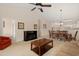 Living and dining area with fireplace, furniture, neutral walls and adjacent kitchen at 334 Kiskadee Loop # 18-L, Conway, SC 29526