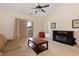 Living room featuring a comfortable sofa, coffee table, fireplace and balcony access at 334 Kiskadee Loop # 18-L, Conway, SC 29526