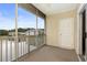 Enclosed patio features a sliding door, screened windows, and relaxing lake views at 334 Kiskadee Loop # 18-L, Conway, SC 29526