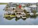 Aerial shot of a waterfront home with a private dock, decks, and lush landscaping at 337 59Th Ave. N, North Myrtle Beach, SC 29582