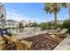 Spacious back deck with outdoor seating overlooking the waterway and surrounding homes at 337 59Th Ave. N, North Myrtle Beach, SC 29582