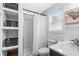 Bathroom featuring a shower, toilet, and vanity area with shelving for storage at 337 59Th Ave. N, North Myrtle Beach, SC 29582