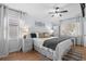 Bedroom with a ceiling fan, hardwood floors, and natural lighting at 337 59Th Ave. N, North Myrtle Beach, SC 29582