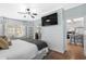 Bedroom featuring hardwood floors, a ceiling fan, and a TV at 337 59Th Ave. N, North Myrtle Beach, SC 29582