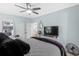 Comfortable bedroom with a TV, ceiling fan, and light blue walls at 337 59Th Ave. N, North Myrtle Beach, SC 29582