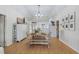 Open floor plan of the dining room offering hardwood floors and stylish lighting at 337 59Th Ave. N, North Myrtle Beach, SC 29582