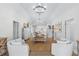 Open-concept dining area with modern chandelier and welcoming furnishings at 337 59Th Ave. N, North Myrtle Beach, SC 29582