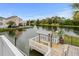 Private boat dock on the waterway, featuring a covered seating area and lush greenery at 337 59Th Ave. N, North Myrtle Beach, SC 29582