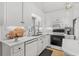 Bright kitchen featuring white cabinetry, modern appliances, and a stylish backsplash at 337 59Th Ave. N, North Myrtle Beach, SC 29582