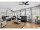 Bright and airy living room with large windows, comfortable seating, and modern decor at 337 59Th Ave. N, North Myrtle Beach, SC 29582
