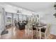 Open-concept living and dining area with hardwood floors and many windows at 337 59Th Ave. N, North Myrtle Beach, SC 29582