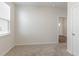 A bright bedroom with a large window and neutral carpet flooring creating a serene and inviting space at 376 Black Pearl Way, Myrtle Beach, SC 29588