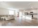 Open-concept living area featuring a modern kitchen, comfortable seating, and bright natural light at 376 Black Pearl Way, Myrtle Beach, SC 29588