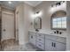 Well-lit bathroom with double sinks, granite countertops, modern fixtures, and tile flooring at 404 Plantation Oaks Dr., Myrtle Beach, SC 29579