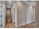 Hallway featuring hardwood floors, clean white trim, recessed lighting, and access to multiple rooms at 404 Plantation Oaks Dr., Myrtle Beach, SC 29579