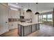 Modern kitchen featuring a large island, stainless steel appliances, and ample cabinet space at 404 Plantation Oaks Dr., Myrtle Beach, SC 29579
