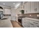 Bright kitchen with stainless steel appliances, granite counters, and a stylish tile backsplash at 404 Plantation Oaks Dr., Myrtle Beach, SC 29579