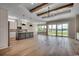 Open-concept living space with hardwood floors, recessed lighting, and a sliding glass door at 404 Plantation Oaks Dr., Myrtle Beach, SC 29579
