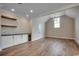 Inviting living space featuring custom cabinets, beverage fridge, and hardwood floors at 404 Plantation Oaks Dr., Myrtle Beach, SC 29579