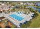 Aerial view of an olympic sized swimming pool surrounded by lounge chairs and landscaping at 404 Plantation Oaks Dr., Myrtle Beach, SC 29579
