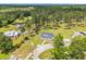 Captivating aerial view of a charming home with manicured landscaping and a long drive leading to a picturesque rural setting at 4074 Center Rd., Georgetown, SC 29440