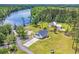 Stunning waterfront home with large lawn, mature trees, and private dock on the river at 4074 Center Rd., Georgetown, SC 29440