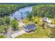Breathtaking aerial view of a home with waterfront access, showcasing the expansive yard and private dock at 4074 Center Rd., Georgetown, SC 29440